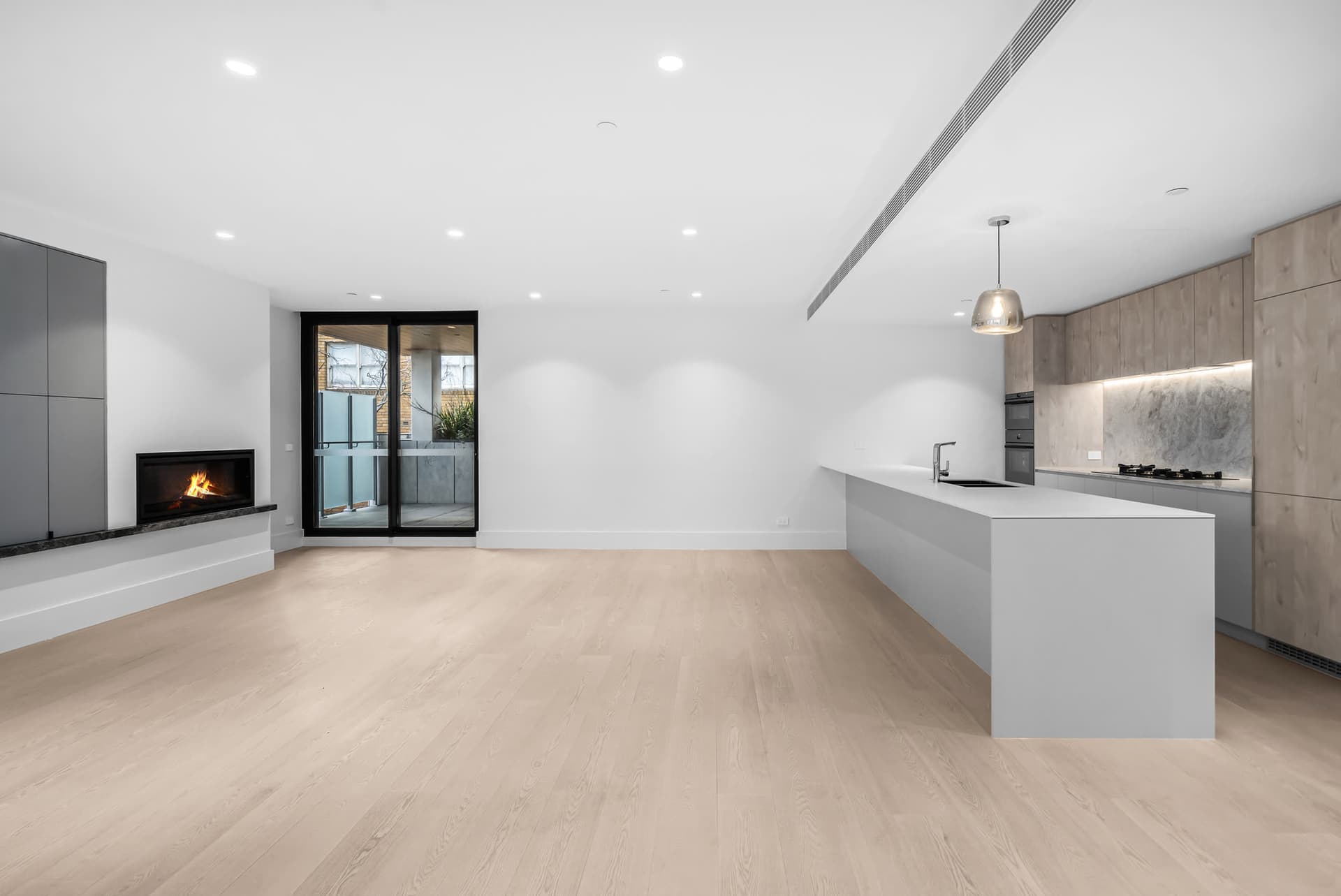 Minimalist penthouse living space at 201/1 Union Street, Melbourne