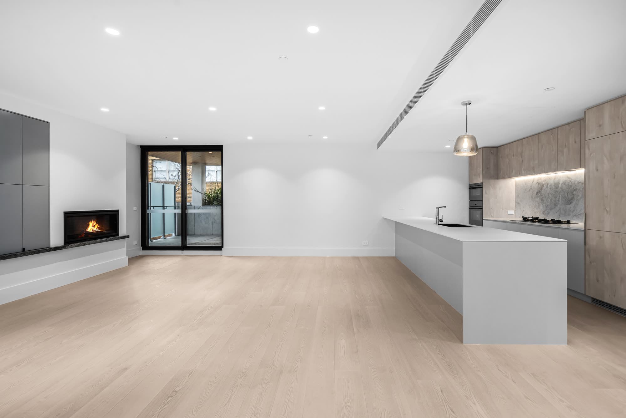 Minimalist penthouse living space at 201/1 Union Street, Melbourne